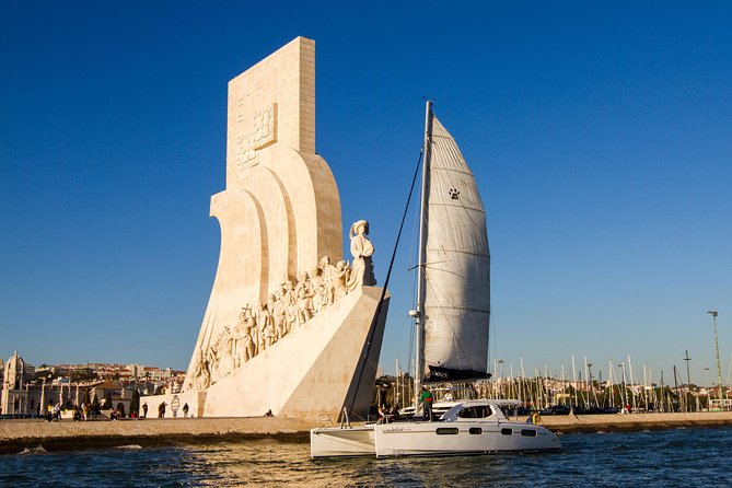 Lisbon: Sunset Cruise With Drinks on Spacious Yacht - The sunset stop near the bridge