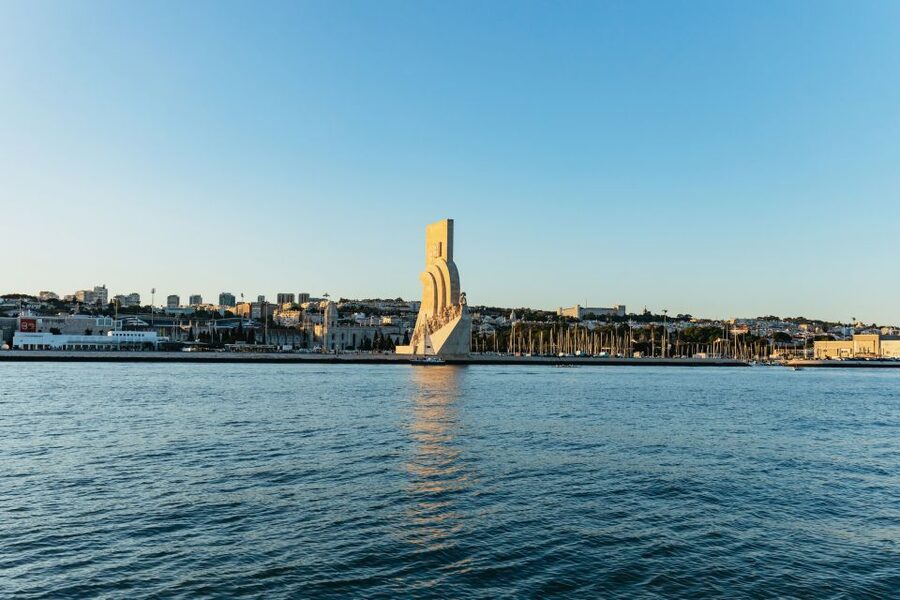 Lisbon: Sunset Cruise with Welcome Drink and Snacks - Passing beneath the 25 April Bridge