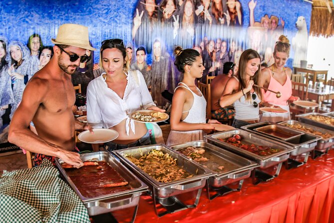 Live this unique experience. Catamaran to Isla Mujeres Tour. Open Bar included. - Downtown Isla Mujeres for a quick look around
