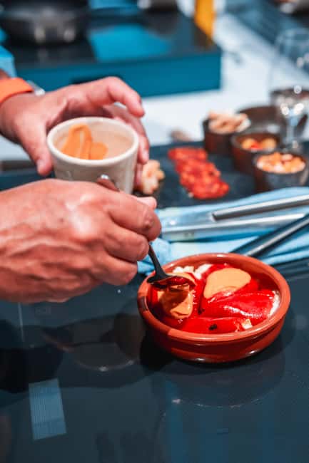 Madrid: Tapas Cooking Class with bottomless Wine Pairing - A Madrid cooking class built around the whole meal