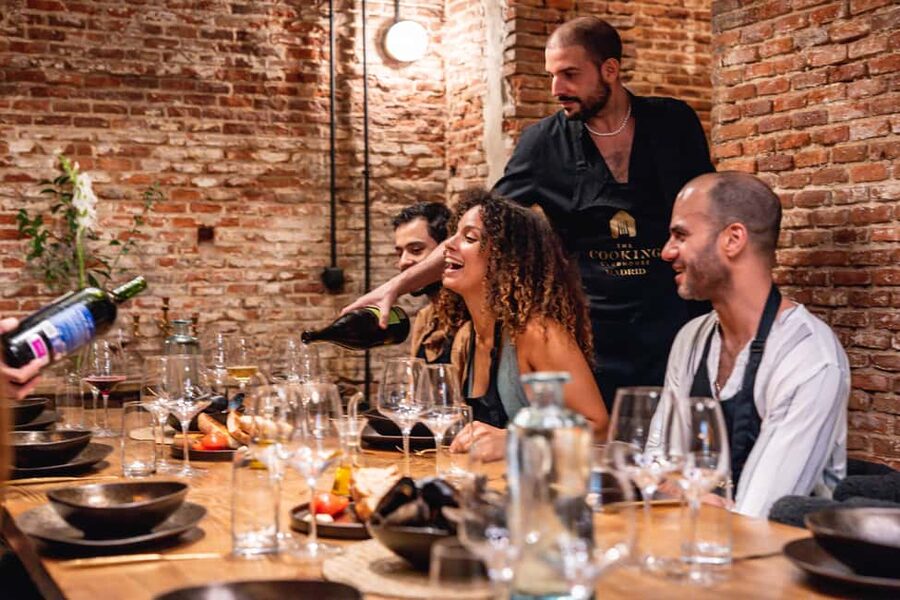 Madrid: Tapas Cooking Class with bottomless Wine Pairing - Making five traditional Spanish tapas in pairs