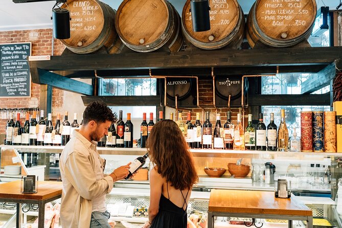 Madrid Tapas & Wine Tour with Rooftop Views and Local Guide - Iberian ham near Plaza Mayor