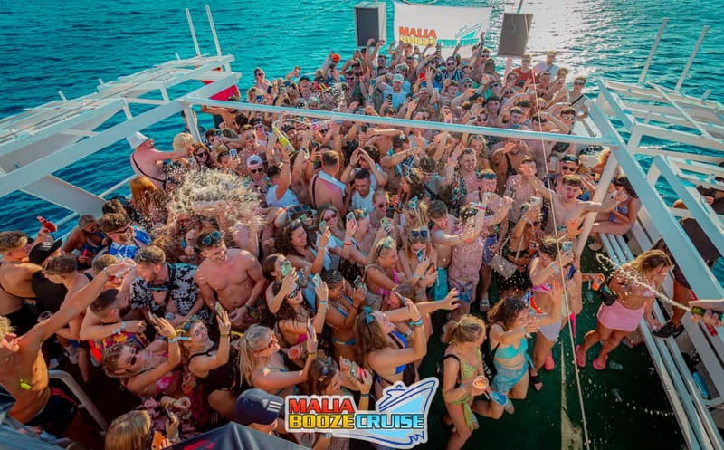 Malia: Booze Cruise Boat Party with Live Dj - Sunset views and the photographer