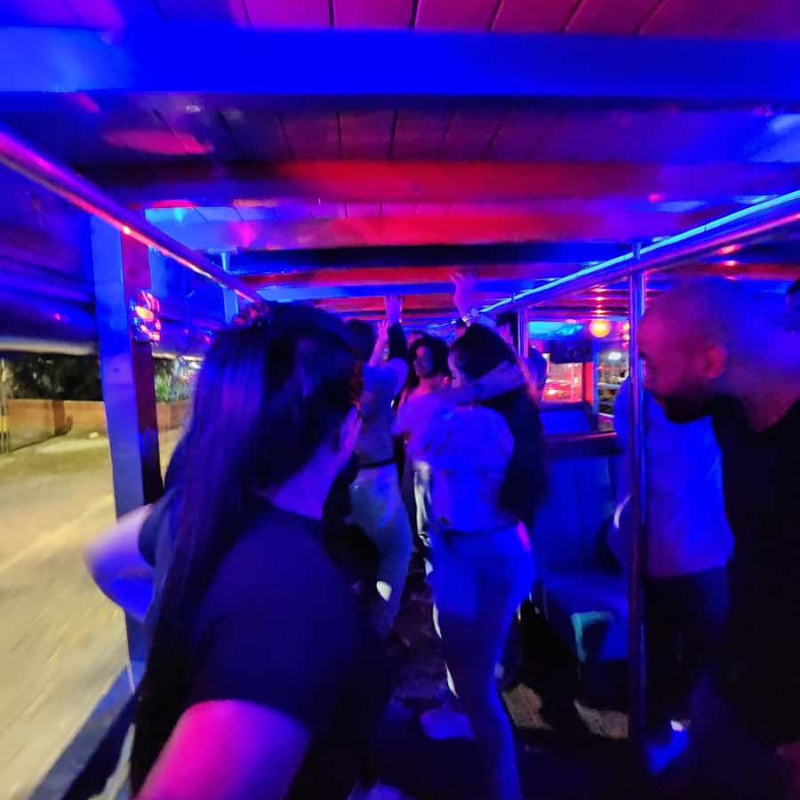 Medellin: Party Bus with DJ & Street Food Tastings - Music, language, and the social mood