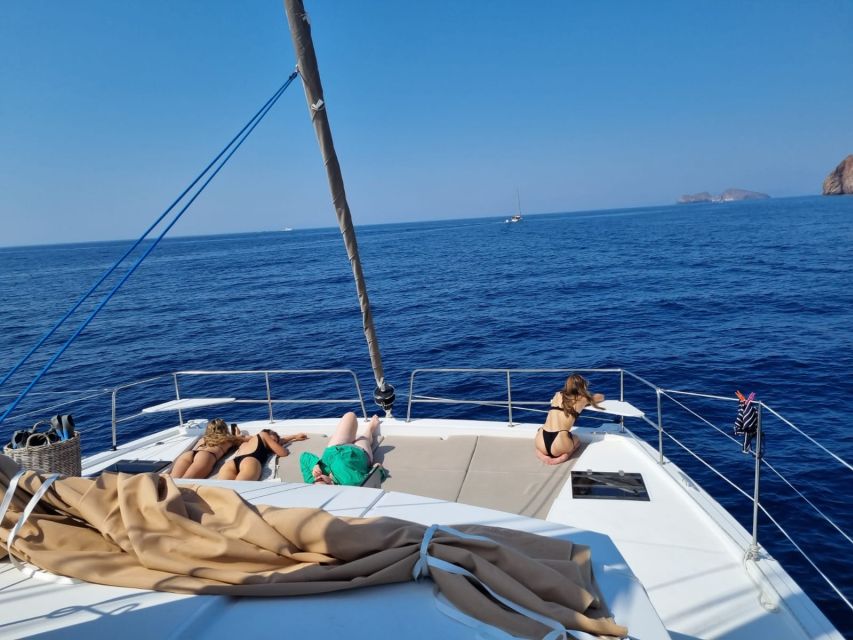 Milos: Full-Day Catamaran Cruise with Food and Open Bar - Leaving Adamantas on the catamaran Together
