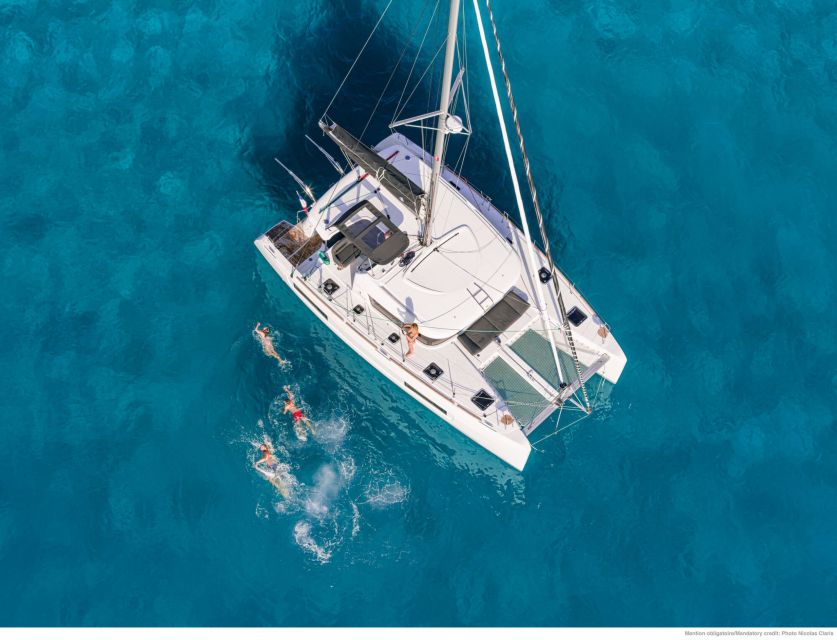 Mykonos: Catamaran Cruise with Lunch, Drinks and Transfer - Leaving Mykonos by catamaran