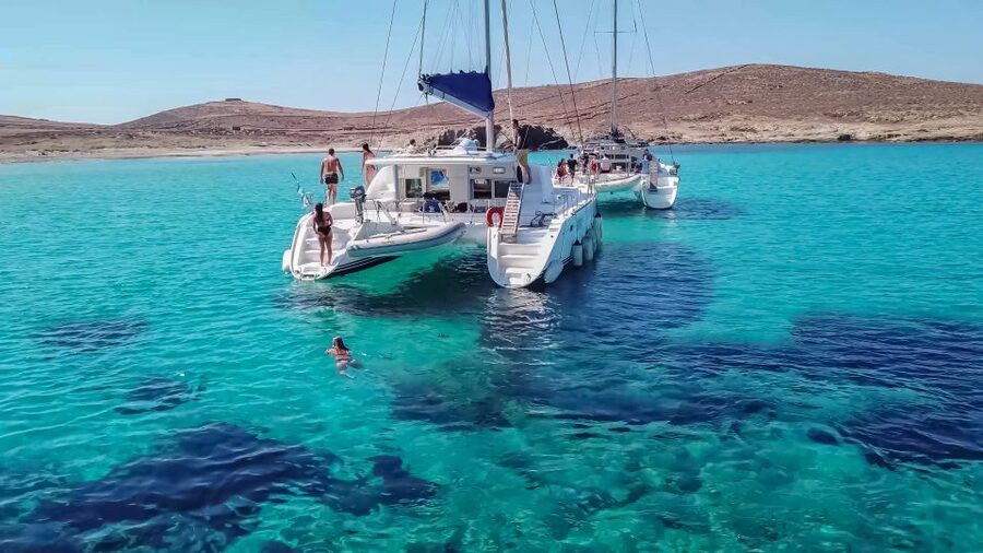 Mykonos: Catamaran Cruise with Lunch, Drinks and Transfer - Lunch, wine, and the social side of the cruise