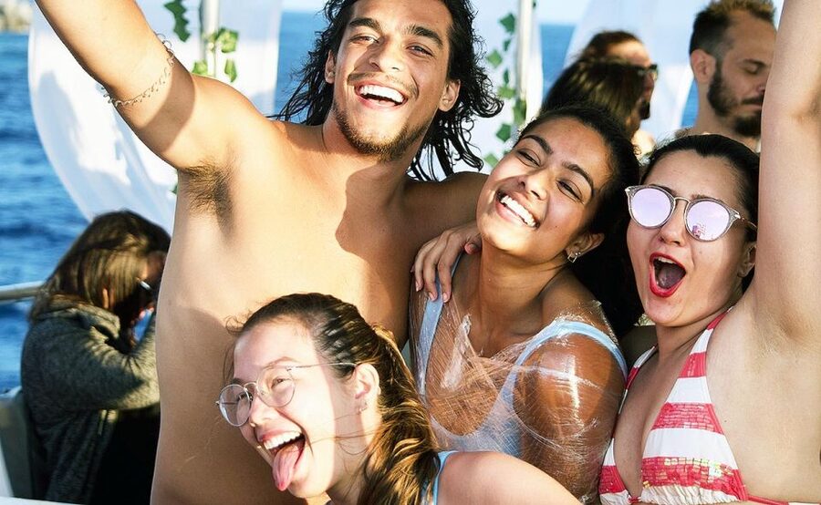 Mykonos: Sunset Boat Party with Open Bar & Live DJ - Music, dancing, and meeting people