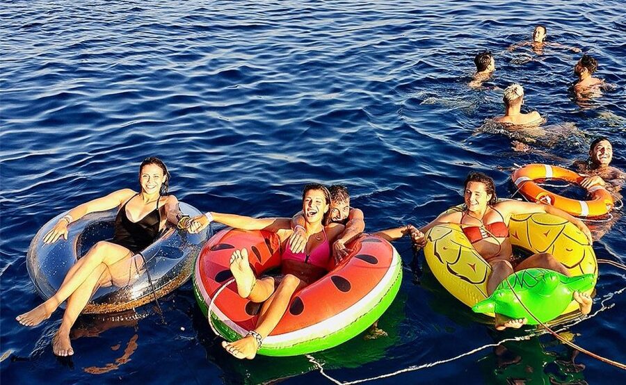 Mykonos: Sunset Boat Party with Open Bar & Live DJ - The swim stop, inflatables, and jumping board