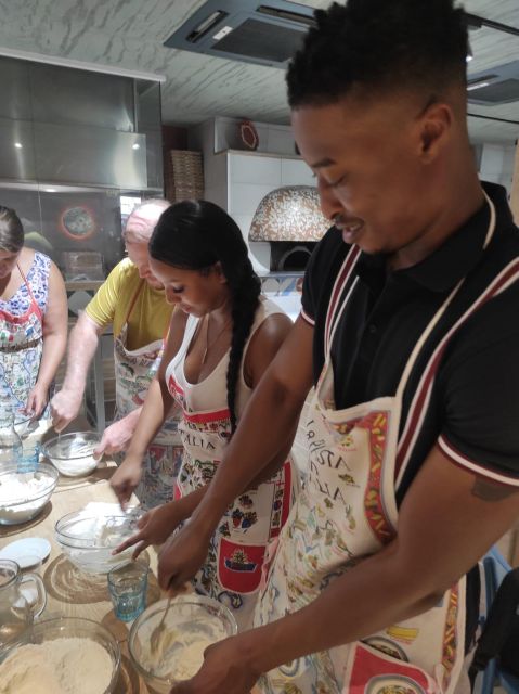 Naples: Small Group Pizza Making with Drink Included - Eating your pizza with a drink