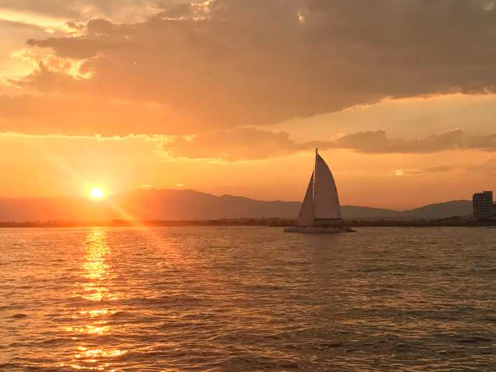Palma de Mallorca: Sunset Sailing Catamaran Trip with Drink - Sailing out from the Auditorium de Palma