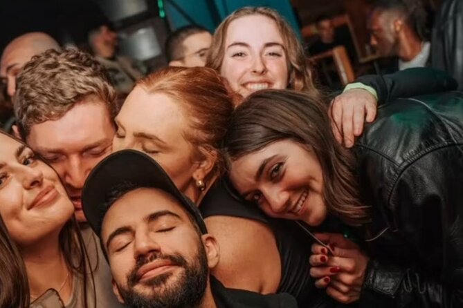 Paris: City Center Guided Pub Crawl with Shots & Club Entry - Walking between central bars and Porte-Saint-Denis