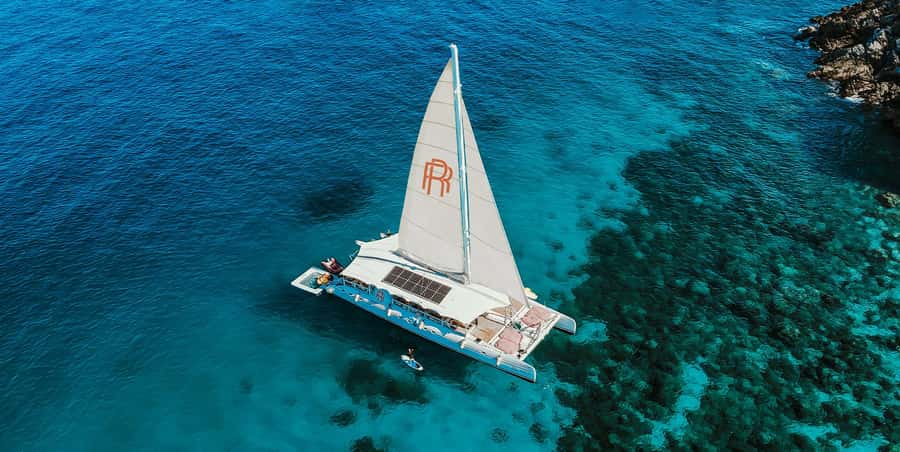 Phuket: Coral & Racha Sunset Luxury Catamaran Party Cruise - Check-in and the first hour aboard Rhapsody