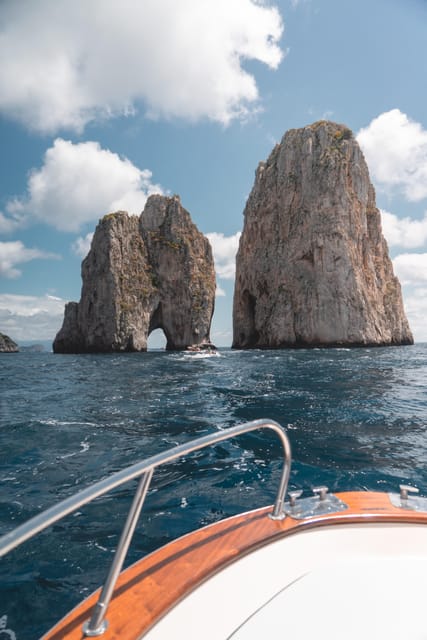 Positano: Capri and Blue Grotto Shared Boat Tour with Drinks - Returning with drinks and limoncello