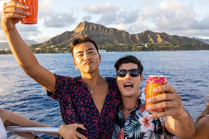 Premier Waikiki Sunset Party Cruise with Live DJ and Full Bar - Waikiki coastline, music, and the change from sunset to night