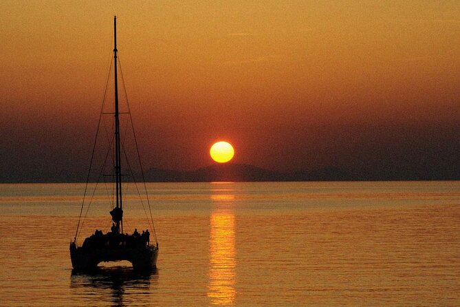Premium Small-Group Catamaran Cruise with BBQ, Open Bar, Transfer - From Vlychada Marina to Red Beach