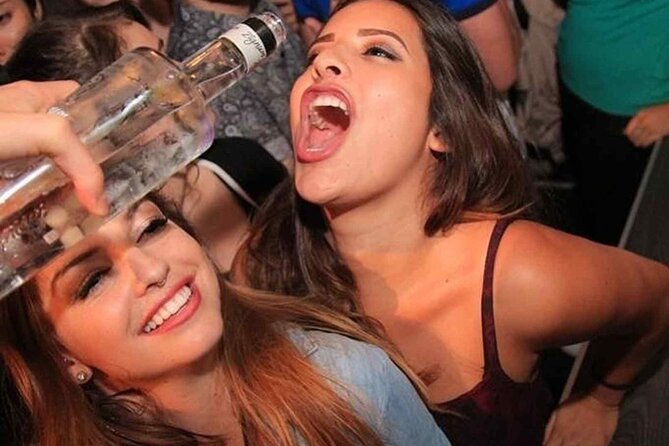 Pub Crawl Barcelona by EVOLVE The BEST night experience - Moving through Plaça Reial and central bars