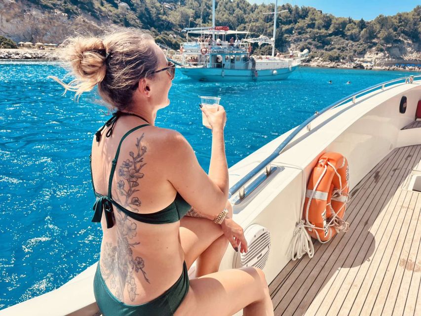 Rhodes: Beach Cruise with Swimming, Meal, & Unlimited Drinks - Finding the Opera Boat at Mandraki Marina
