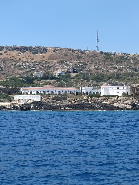 Rhodes: Sunset Cruise to Kallithea with Drinks and Snacks - Mandraki Harbour to Kallithea by wooden boat