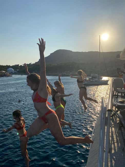 Rhodes: Sunset Cruise with Open Bar, Dinner, & Live Music - Kallithea Bay and the swimming stop