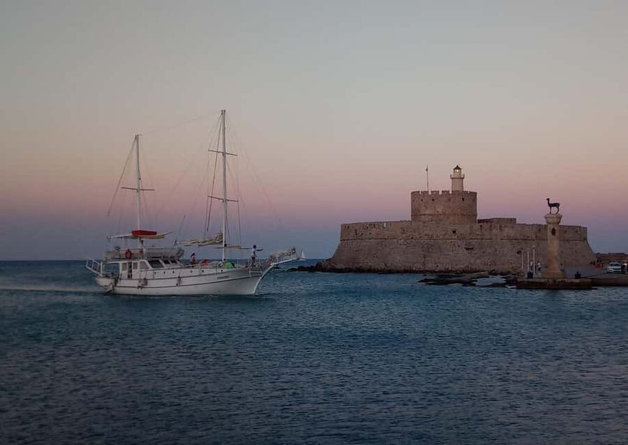 Rhodes: Sunset Cruise with Open Bar, Dinner, & Live Music - Comfort, weather, and timing