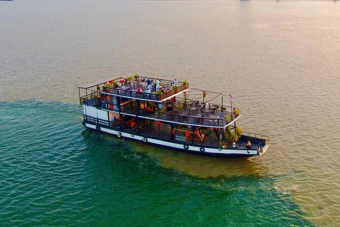 Riverside Walking Tour with Snack, Drinks & Local Ferry Ride - Riverside views of the Royal Palace