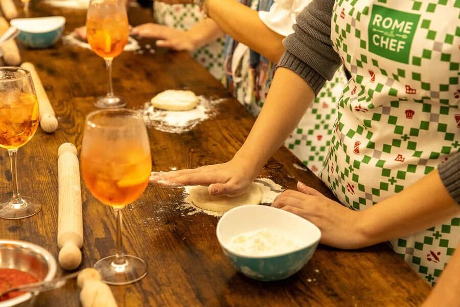 Rome: Hands-On Pizza Cooking Class with Spritz Mixology - Sitting down to eat near the Colosseum