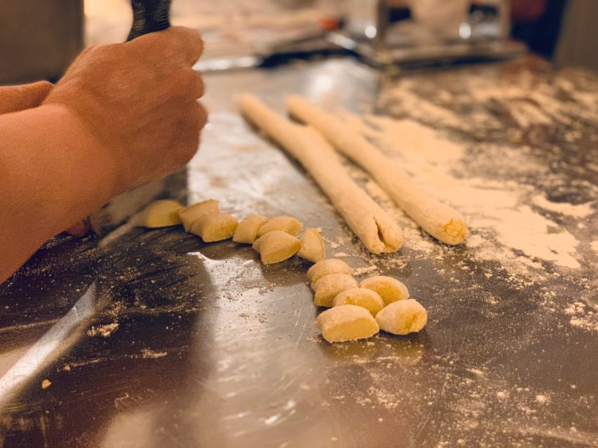Rome: Pasta & Tiramisu Class with Free Flowing Fine Wine - Rolling pasta dough with Patrick and the cooking team