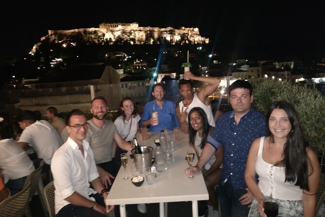 Rooftop Bar Hopping with Local Friends - The third rooftop: cocktails, city lights, and the final stop