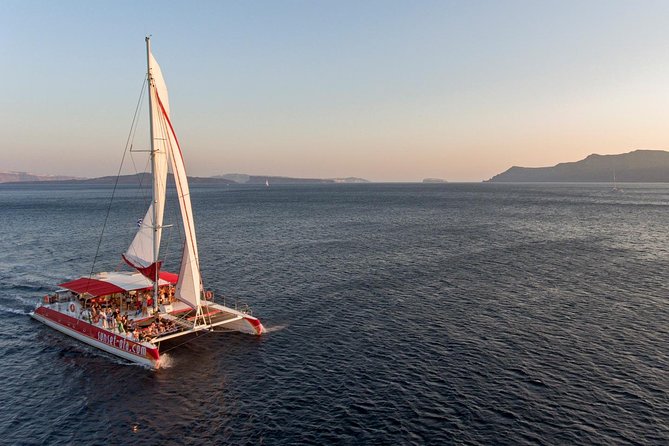 Sailing Catamaran Cruise in Santorini with BBQ, Drinks and Transfer - Swimming near Santorinis hot springs
