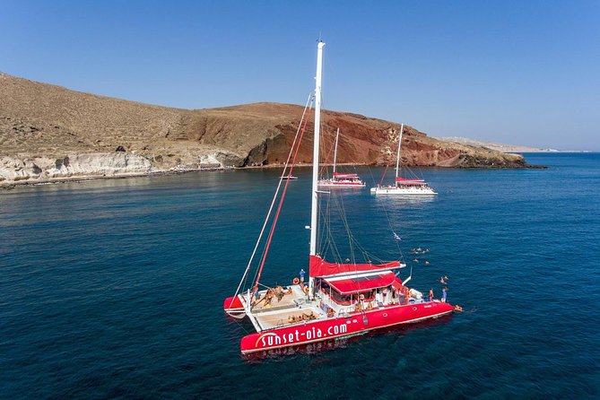Sailing Catamaran Cruise in Santorini with BBQ, Drinks and Transfer - Sailing beside the volcano and Palea Kameni