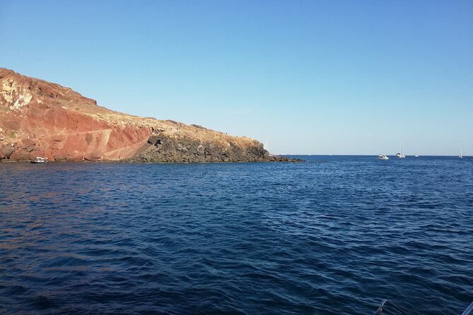 Santorini Catamaran Cruise with Fresh Meal and Open Bar - Red Beach: Santorini’s most striking shoreline