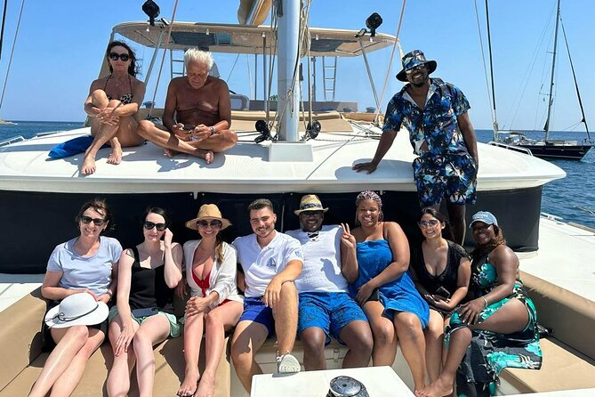 Santorini Catamaran Cruise: with Lunch, BBQ, Open Bar, Transfers - Red Beach gives the cruise its first strong scene