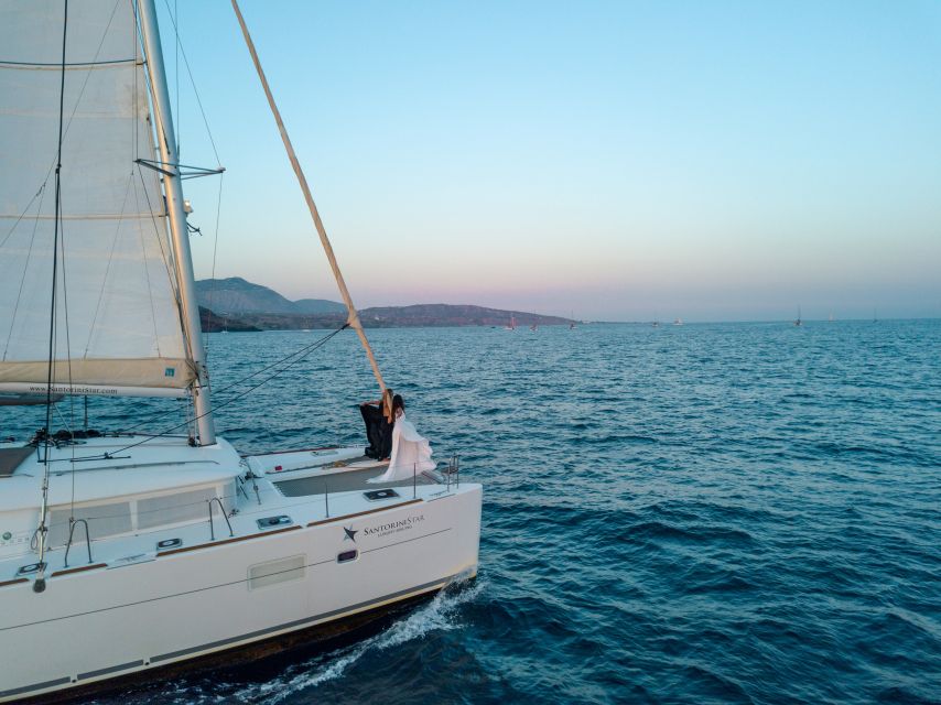 Santorini Catamaran Cruise with Swimming, Meal and Open Bar - Akrotiri Lighthouse and the Caldera coast