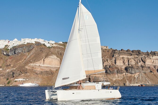 Santorini Gold Catamaran Cruise with BBQ, Drinks and Hotel Pickup - Morning or afternoon: which departure works best?