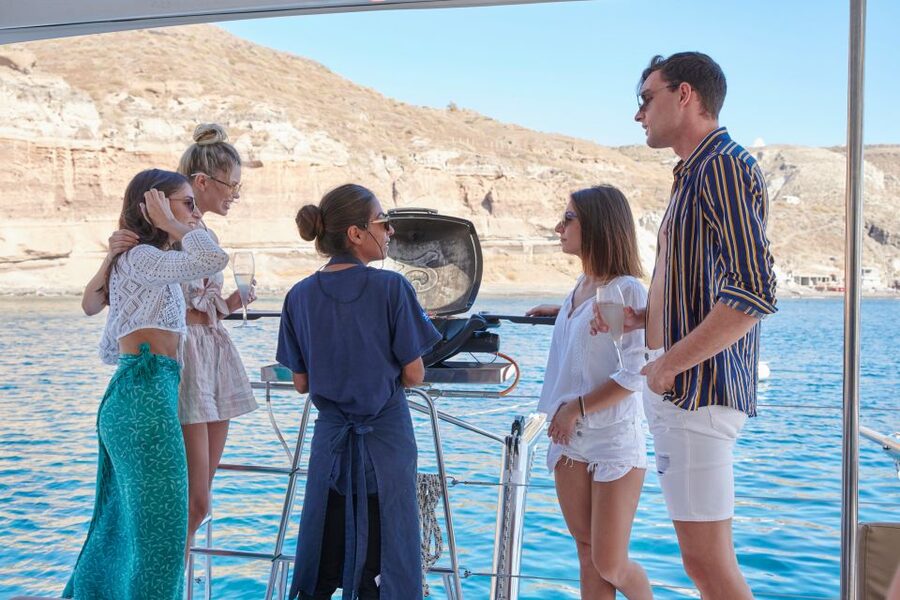 Santorini Gold Catamaran Cruise with Snorkel, BBQ & Open Bar - Open wine, music, and a relaxed pace