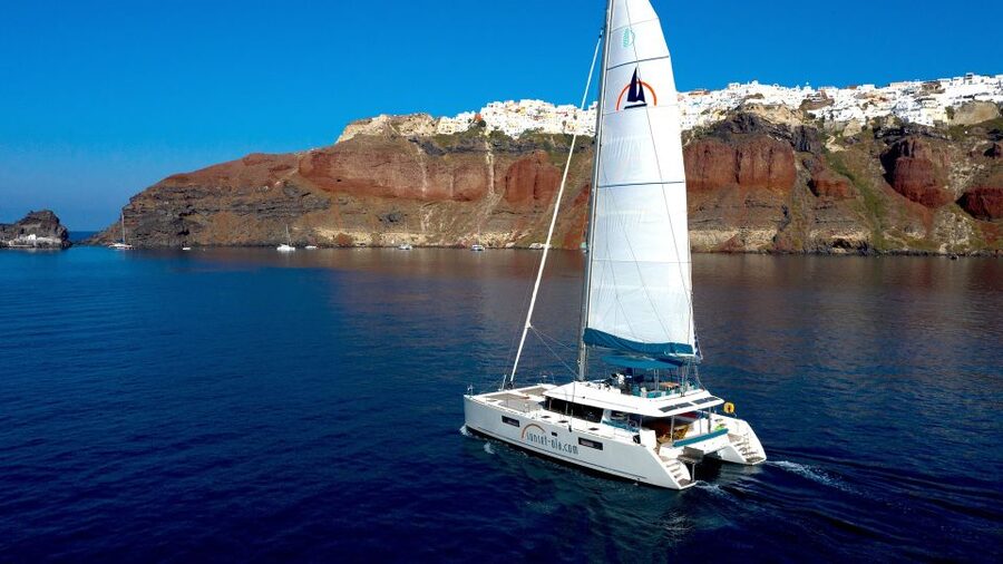Santorini: Luxurious Catamaran Cruise with Meal & Open Bar - White Beach: The Longest Stop and Main Meal