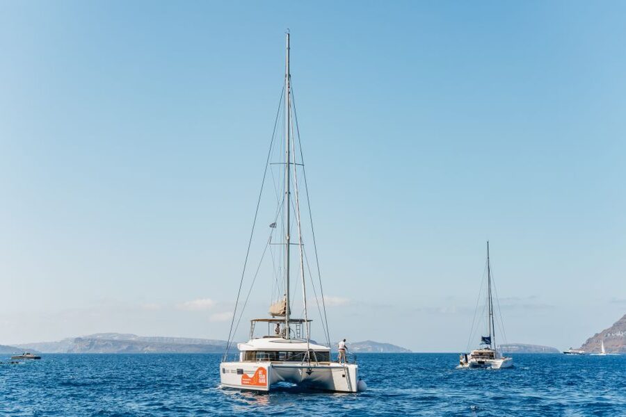 Santorini: Luxury Catamaran Day Trip with Meal and Open Bar - Red Beach and White Beach by water