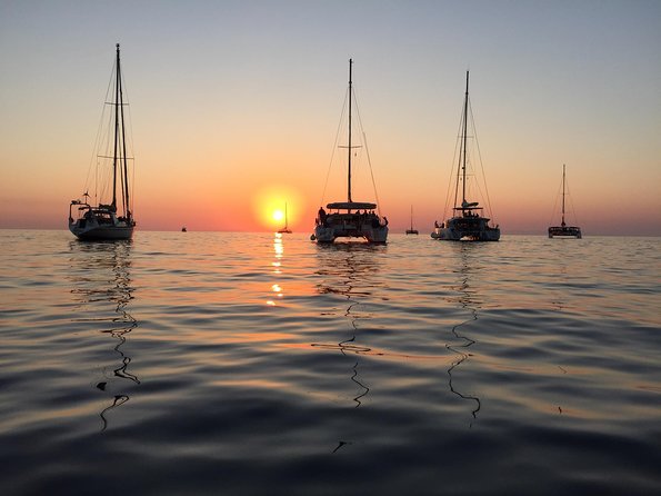 Santorini Luxury Catamaran Sunset Cruise with BBQ, Drink and Transfer - White Beach, BBQ, and the longest stop