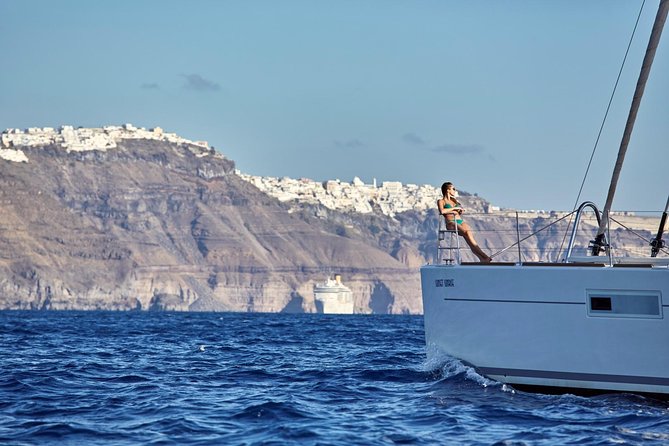 Santorini Luxury Sailing Catamaran Cruise with BBQ, Drinks and Transfer - White Beach, cliffs, and the main meal