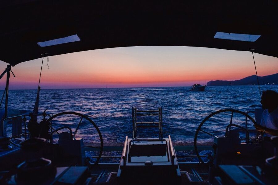 Santorini: Private Caldera Sailing Trip with Open Bar & Meal - Entering the caldera below the Venetian Lighthouse