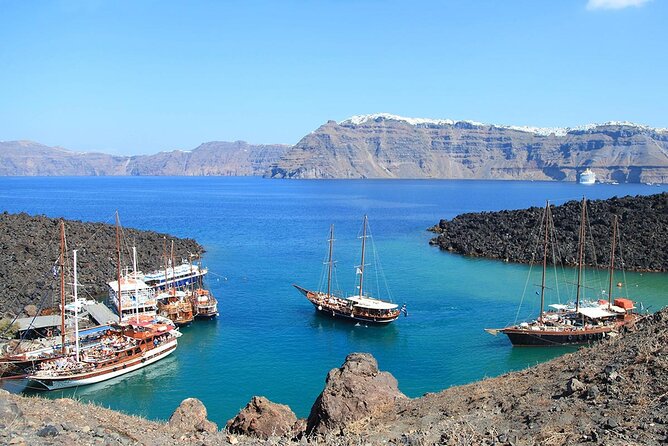 Santorini Sunset Sailing Cruise: Dinner, BBQ, Open Bar, Transfers - White Beach, Indian Rocks, and the Venetian Lighthouse