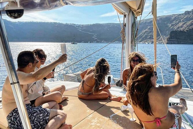 Santorini Sunset Sailing Cruise: Dinner, BBQ, Open Bar, Transfers - Red Beach gives you Santorini’s boldest first view