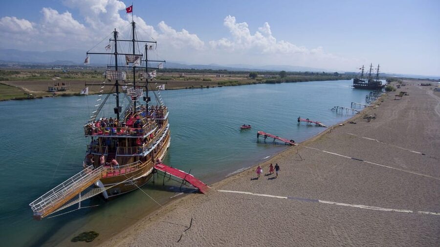 Side: Dolphin Island Boat Trip with Lunch & Unlimited Drinks - Coastal views from Side’s ancient port to Apollo Temple