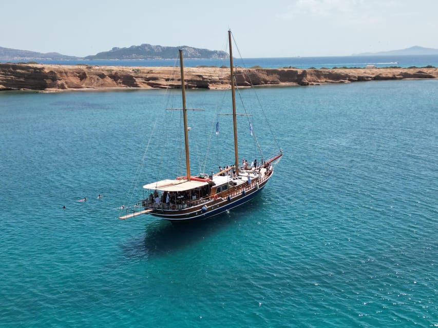 Sunset Dinner Cruise: Swim Stop, Drinks & Onboard Dining - Sailing past Vouliagmeni and the Four Seasons
