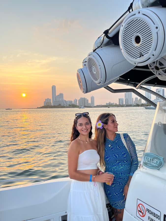 Sunset Party open bar on the bay while sharing with locals - Leaving Pegasus Pier beside Cartagena’s Clock Tower