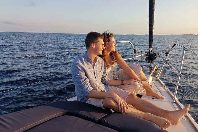 Sunset Sailboat Tour along the Coast with Open Bar - Cava, snacks, blankets, and the onboard mood