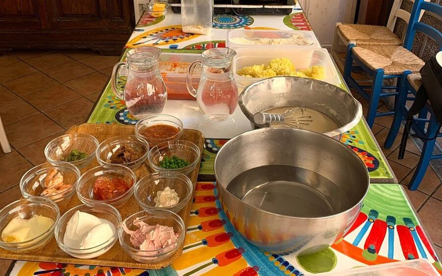 Taormina: Arancino Making Class with Drinks - Sitting down to eat a Sicilian meal
