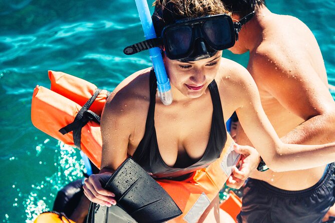 The Best Catamaran tour to Isla Mujeres with Open Bar and Lunch - A 30-minute snorkeling stop at the Cancun reef